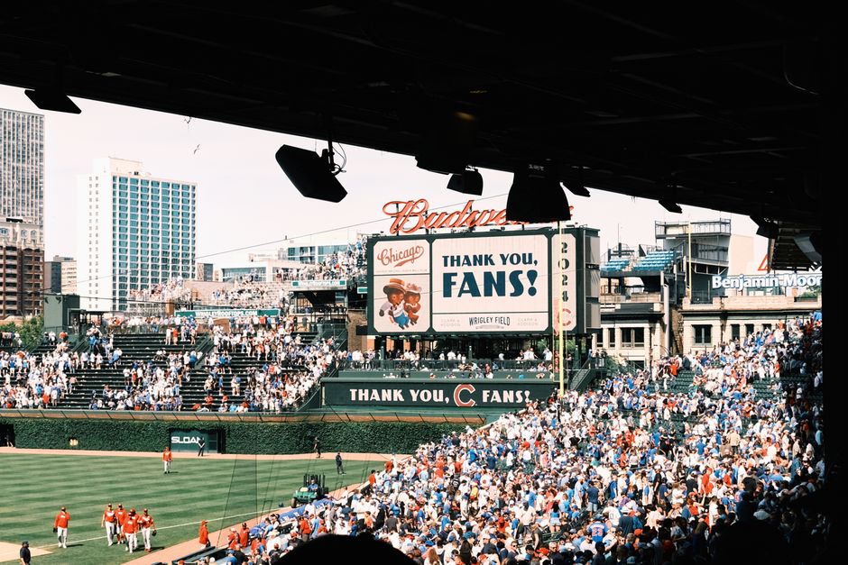 Orioles fans arriving at Camden Yards for a night game — group transportation from downtown