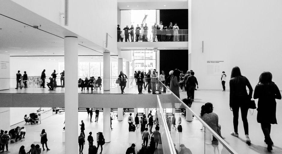 Museum visitors touring Baltimore historic galleries — group charter bus transportation